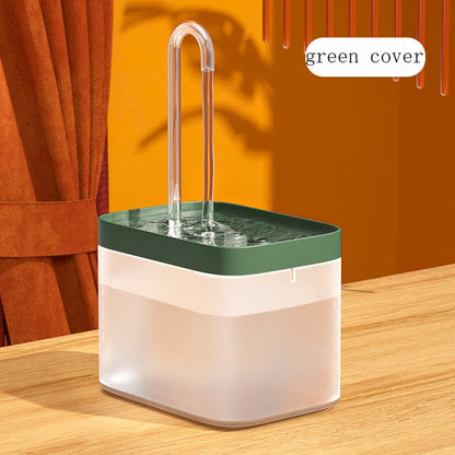 Automatic cat water fountain with green top, clear spout, and recirculating water bowl