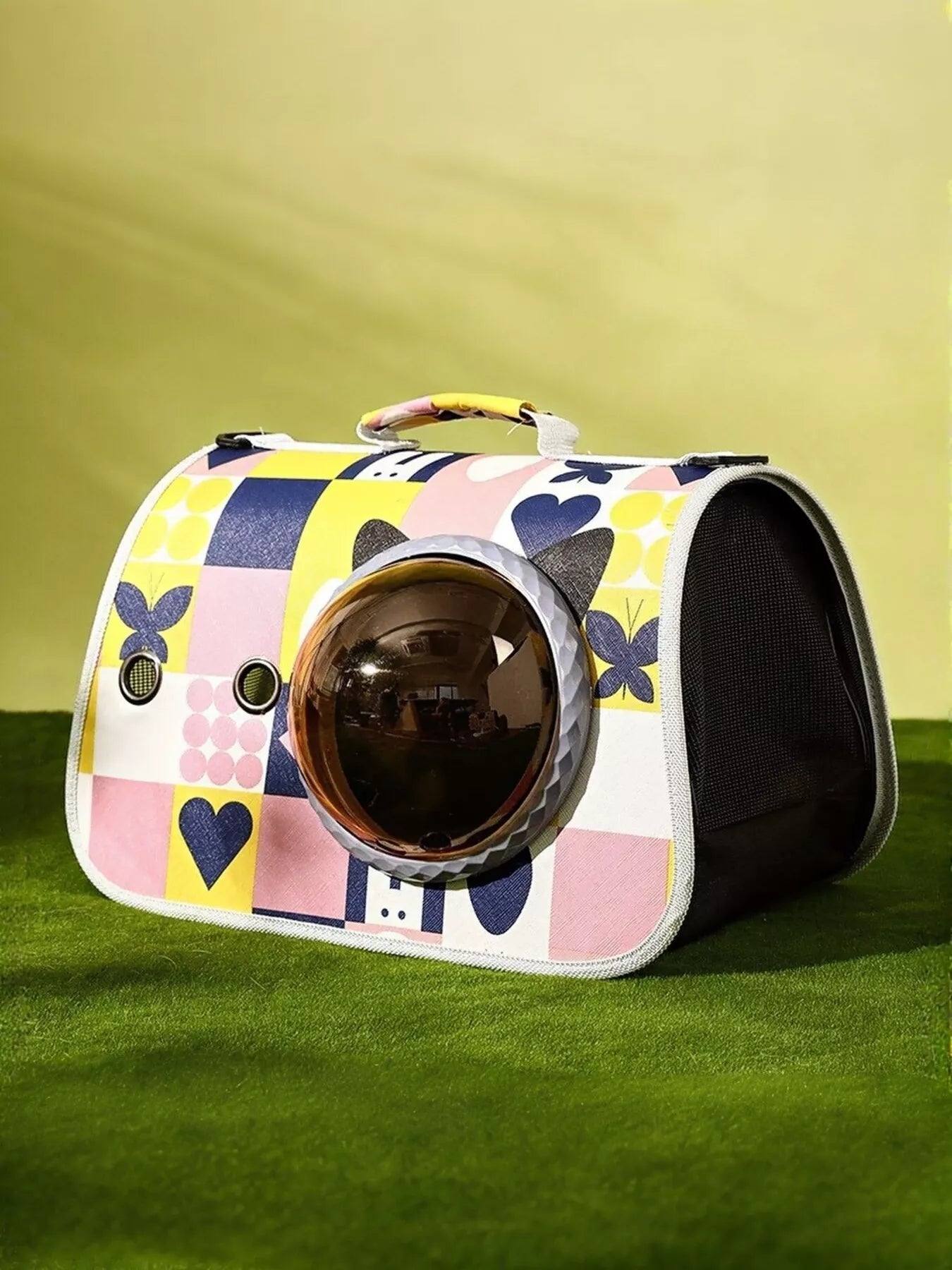 Colorful patterned pet carrier bag with round bubble window and dark side panels