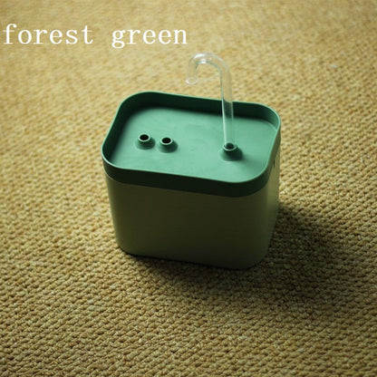 Automatic cat water fountain with forest green top, clear spout, and recirculating water bowl