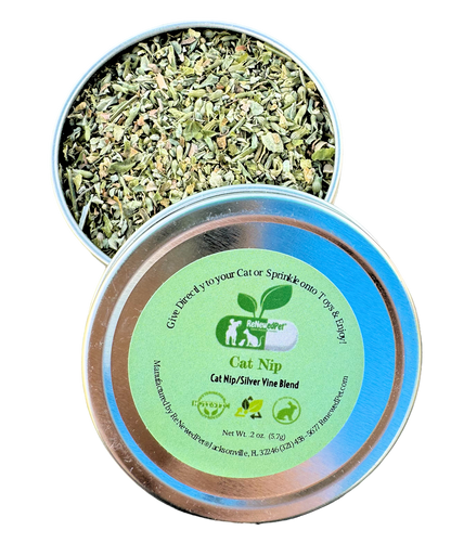 Cat nip and silver vine blend tin with loose green herb leaves, lid label visible