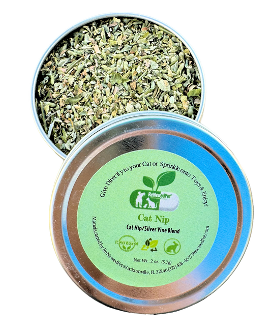 Cat nip and silver vine blend tin with loose green herb leaves, lid label visible