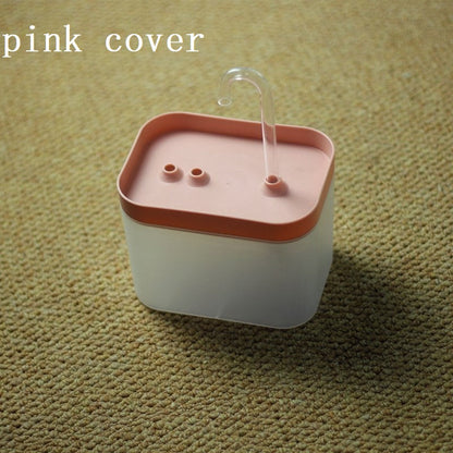 Automatic cat water fountain with pink top, clear spout, and recirculating water bowl