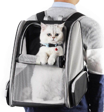 Grey bubble pet travel carrier holding a white cat, front mesh window and padded base