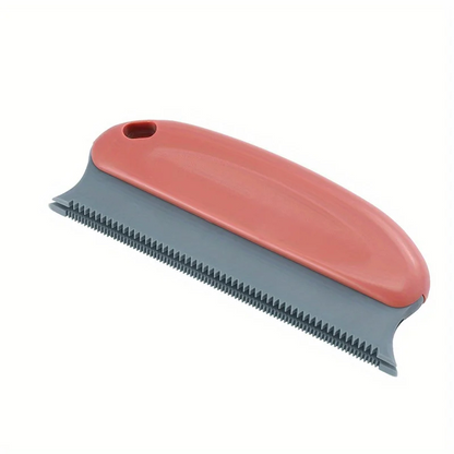 Coral and gray pet hair remover brush with black ridged edge