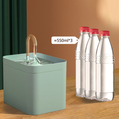 Automatic cat water fountain with raised spout and 1.5L-style capacity bottles display