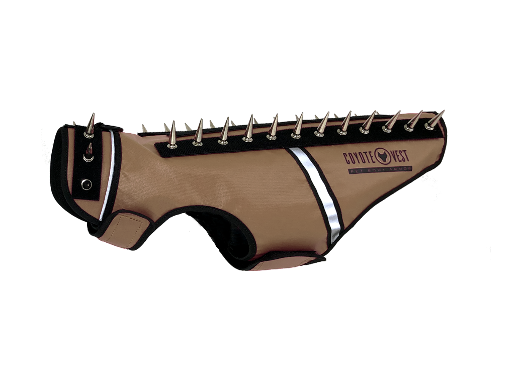 Tan spike-studded cat vest with black trim and metal studs along top edge