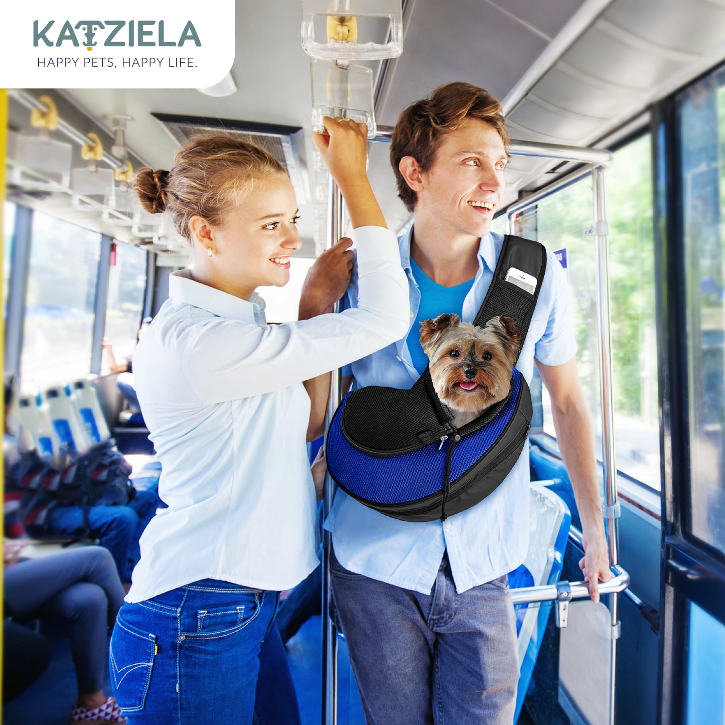 Person wearing blue-and-black expandable sling pet carrier with front mesh window