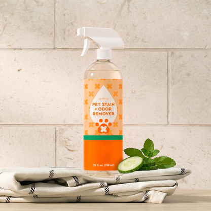 Pet Stain & Odor Remover spray bottle with cucumber-mint scent, on folded towels