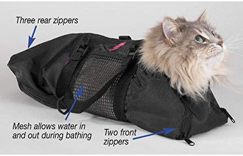 Black grooming bag with mesh panels and front zippers, on cat