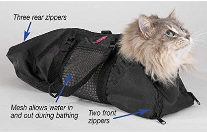 Black grooming bag with mesh panels and front zippers, on cat