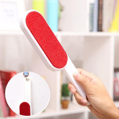 Reusable pet hair remover brush with red pad and white handle for fabric hair