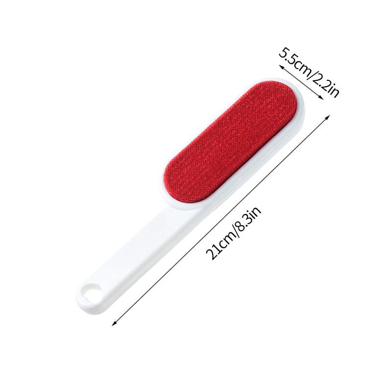 Red pet hair remover lint brush with white handle and rectangular lint pad