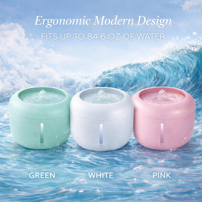 Three pet water fountains in green, white, and pink with bubbling tops.