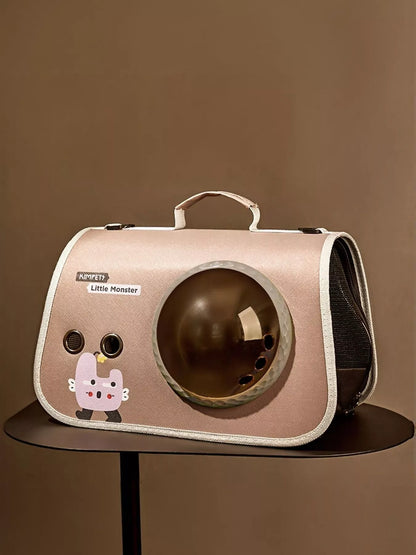 Pink pet carrier bag with round bubble window and cat-themed applique