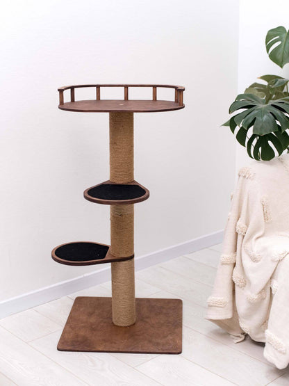 Small cat tree with round top bed and two black perches; square base with sisal post.