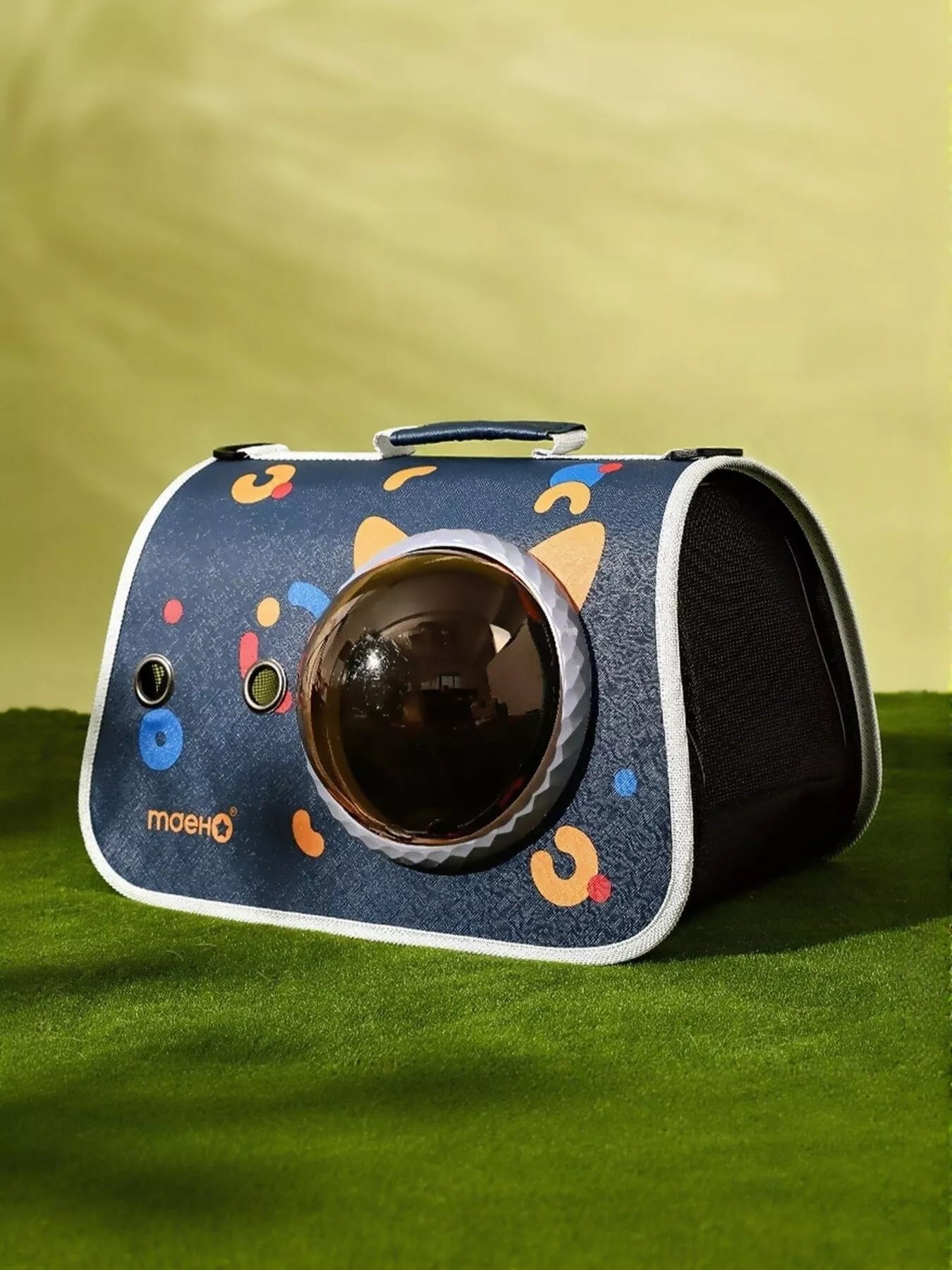 Navy pet carrier bag with playful icons and round bubble window